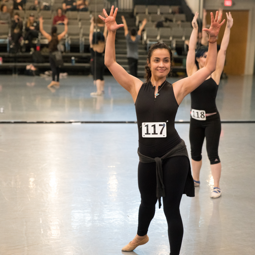 woman in a dance audition wearing the number 117